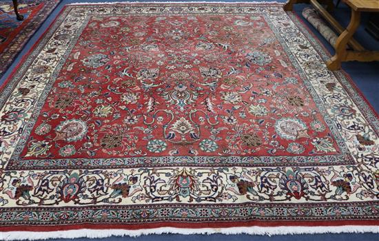 A Tabriz style red ground carpet 10ft x 4ft 6in.